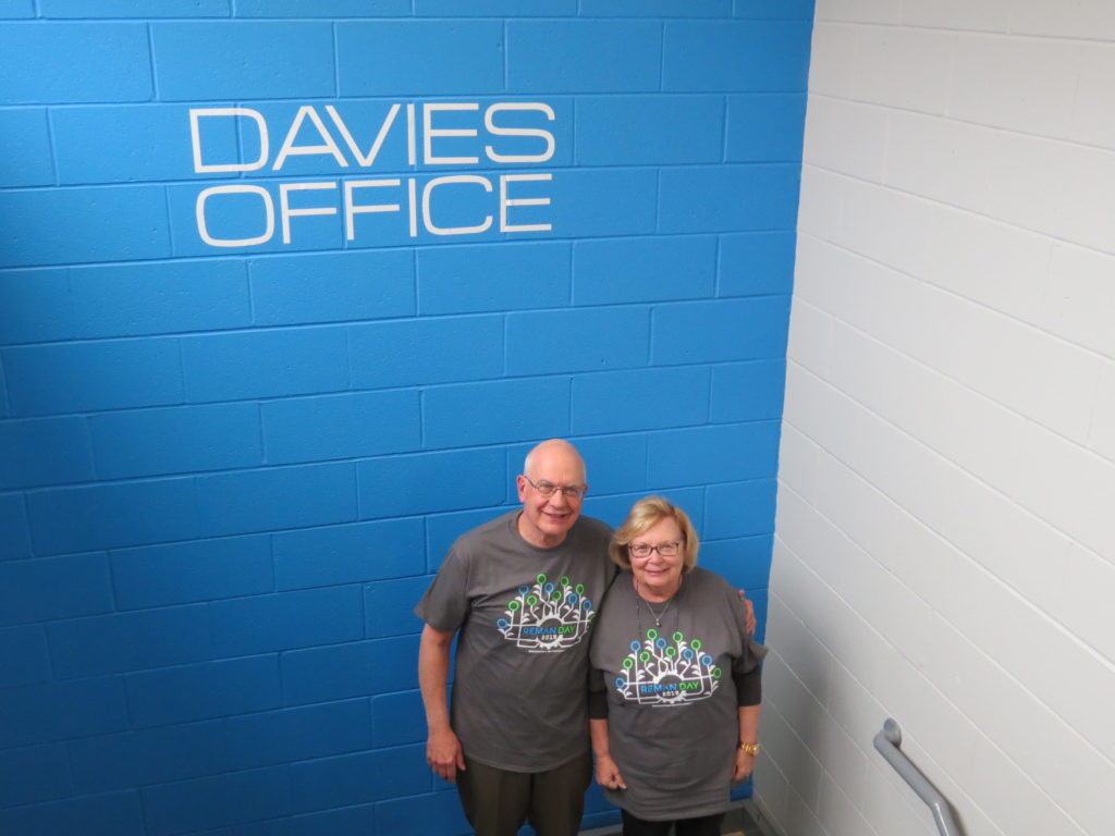 BIll and Evelyn Davies standing in front of Davies sign