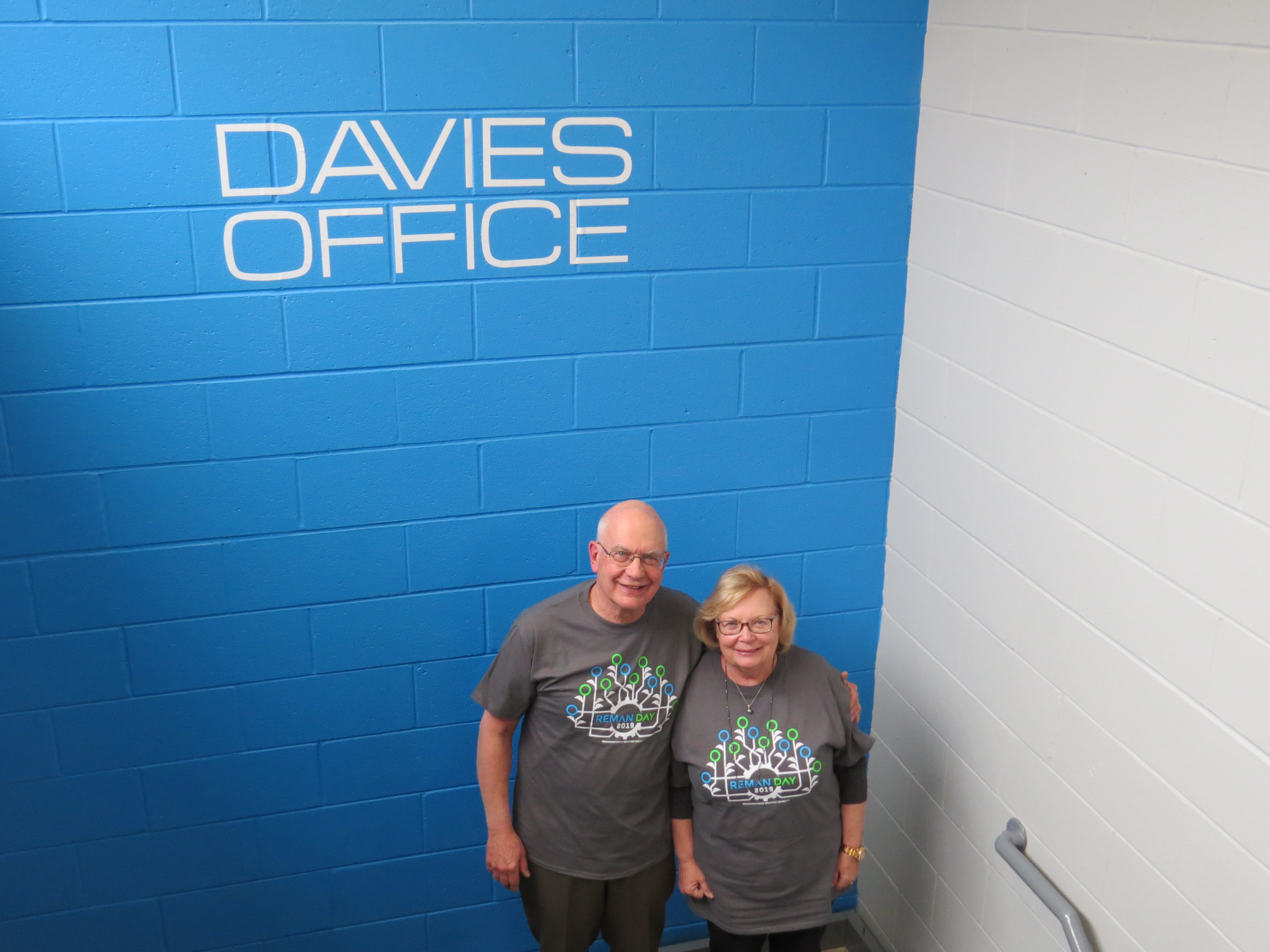 BIll and Evelyn Davies standing in front of Davies sign